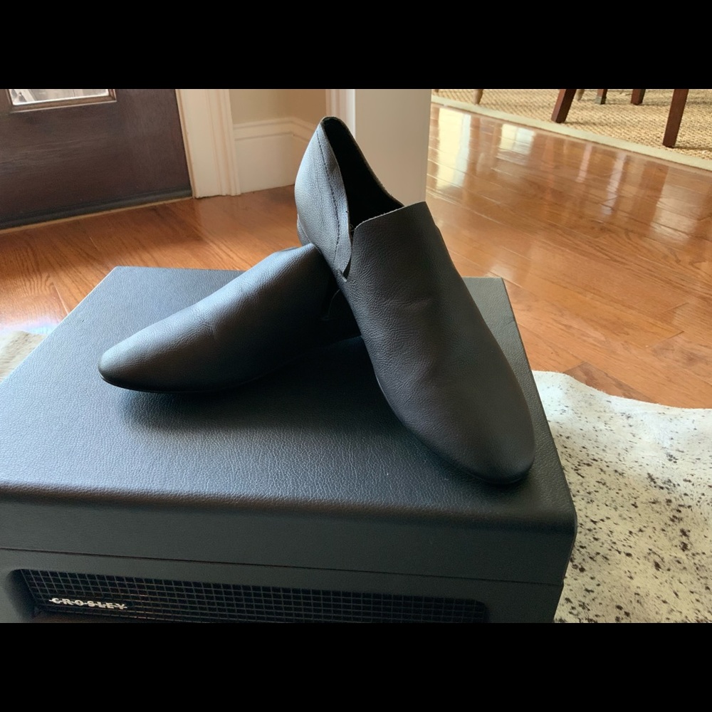Kelsi Dagger black slip on black shoe.